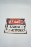 BLASZANY SZYLD - TABLICZKA "BEWARE BARBER AT WORK" 20X25 cm.